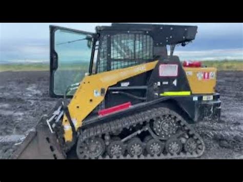 spreading topsoil with a skid steer|Spreading topsoil with a skid steer loader/ posi.